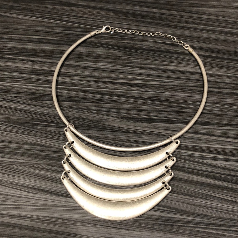 Silver choker necklace.